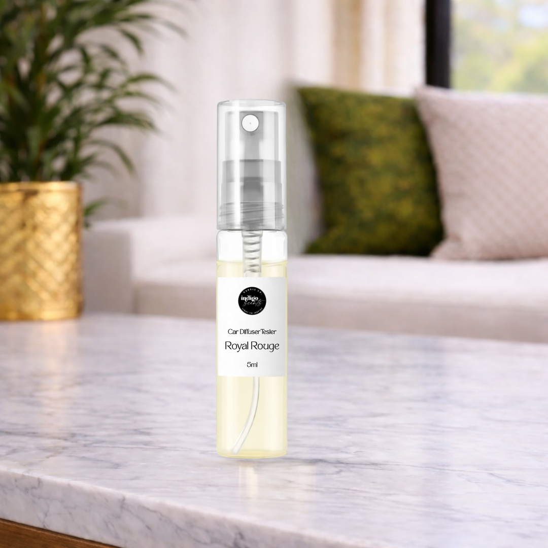 Spray bottle labeled 'Royal Rouge' on a marble surface with a blurred indoor background