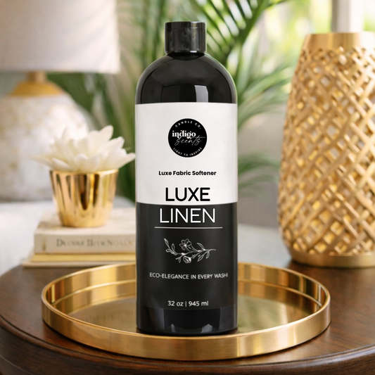 Bottle of Luxe Linen fabric softener on a gold tray with decorative background