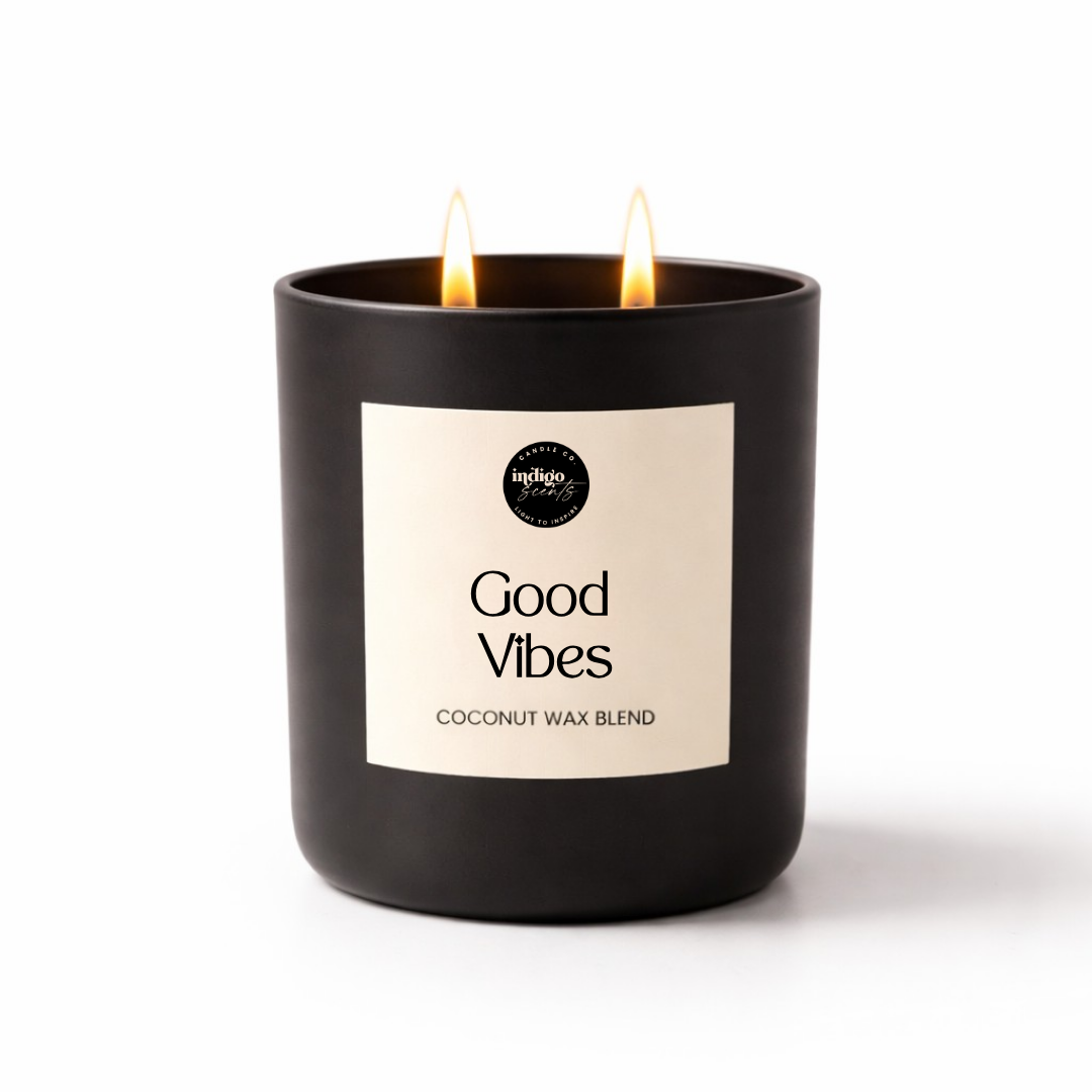 Good Vibes candle in a matte black jar on a white background, featuring an uplifting citrus fragrance with lime, lemongrass, orange, and vanilla