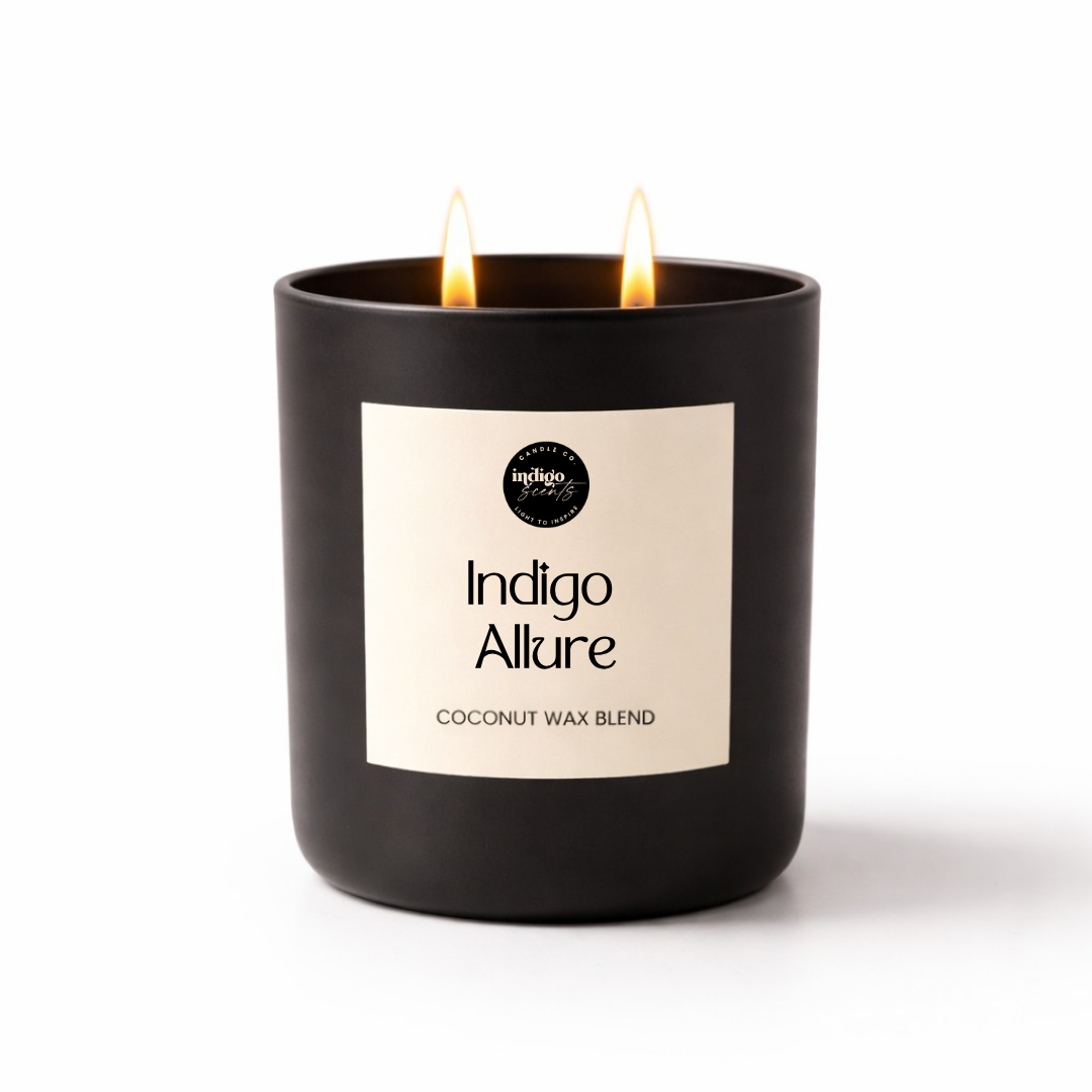 Indigo Allure candle on a white background featuring rich florals, warm woods, patchouli, creamy vanilla, and amber notes