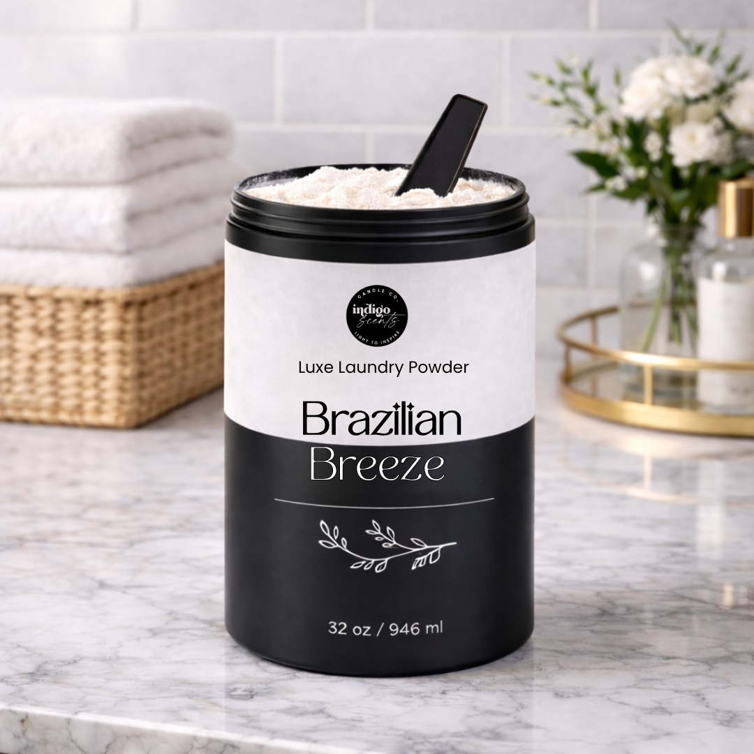 Container of Brazilian Breeze laundry powder on a marble countertop with a white tiled wall and basket in the background.