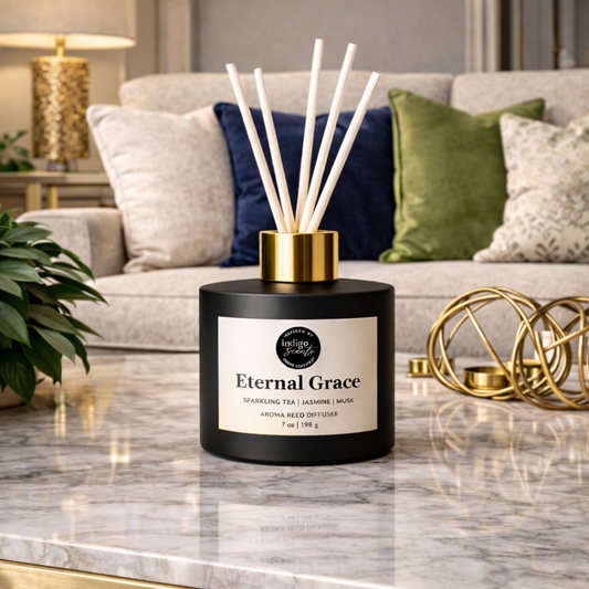 A diffuser bottle labeled 'Eternal Grace' on a marble surface with a living room background.