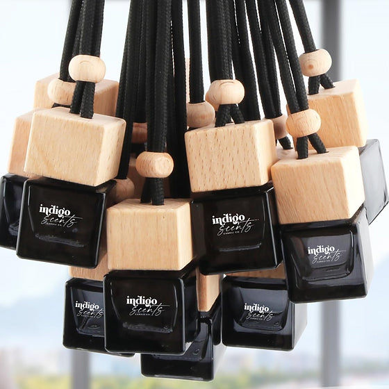 Indigo Scents car diffusers in black bottles with wooden tops